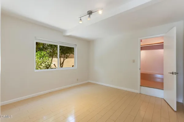 a view of an empty room with a window