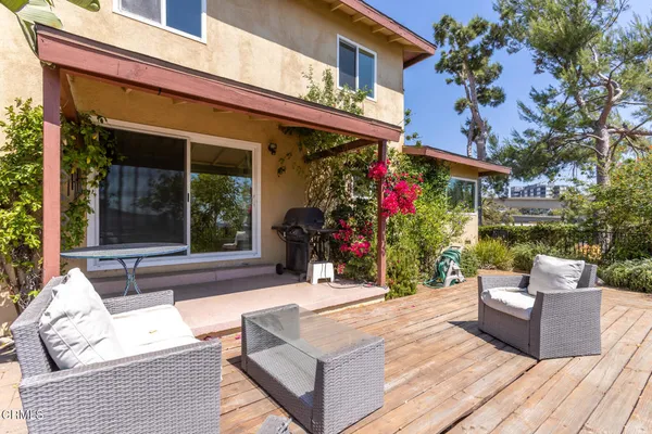 a view of a chairs and table in the patio