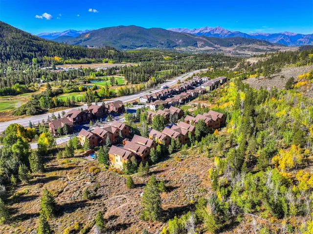 a view of a city with mountains in the background