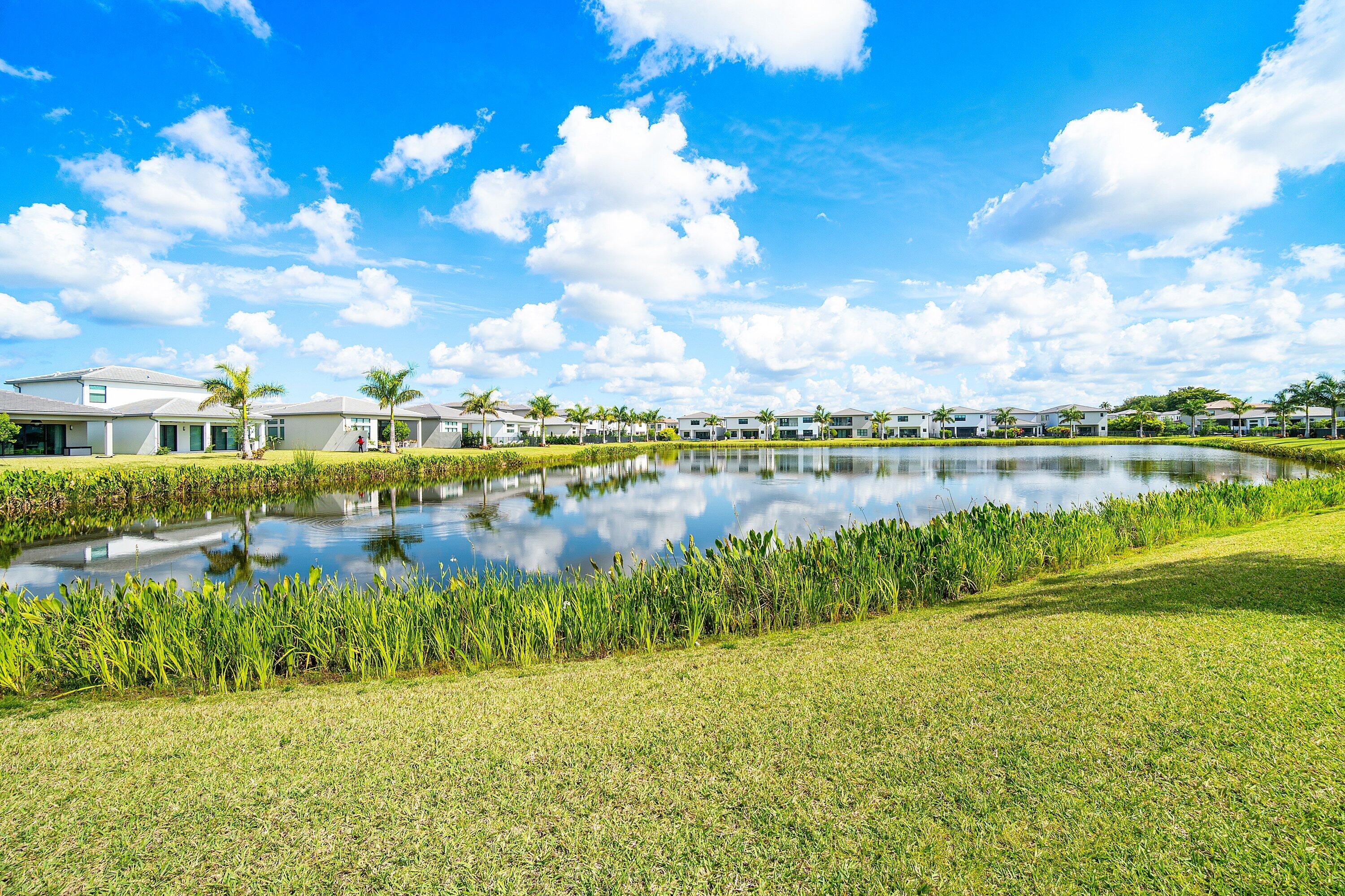 8233 Crystal Downs Avenue Boca Raton, FL 33434 - Photo 58 of 58 a view of a lake with houses in the back