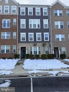 a view of a brick building next to a road