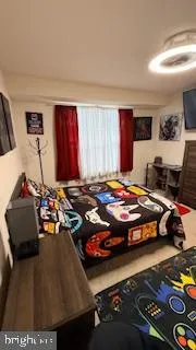 a view of air conditioner and living room with furniture