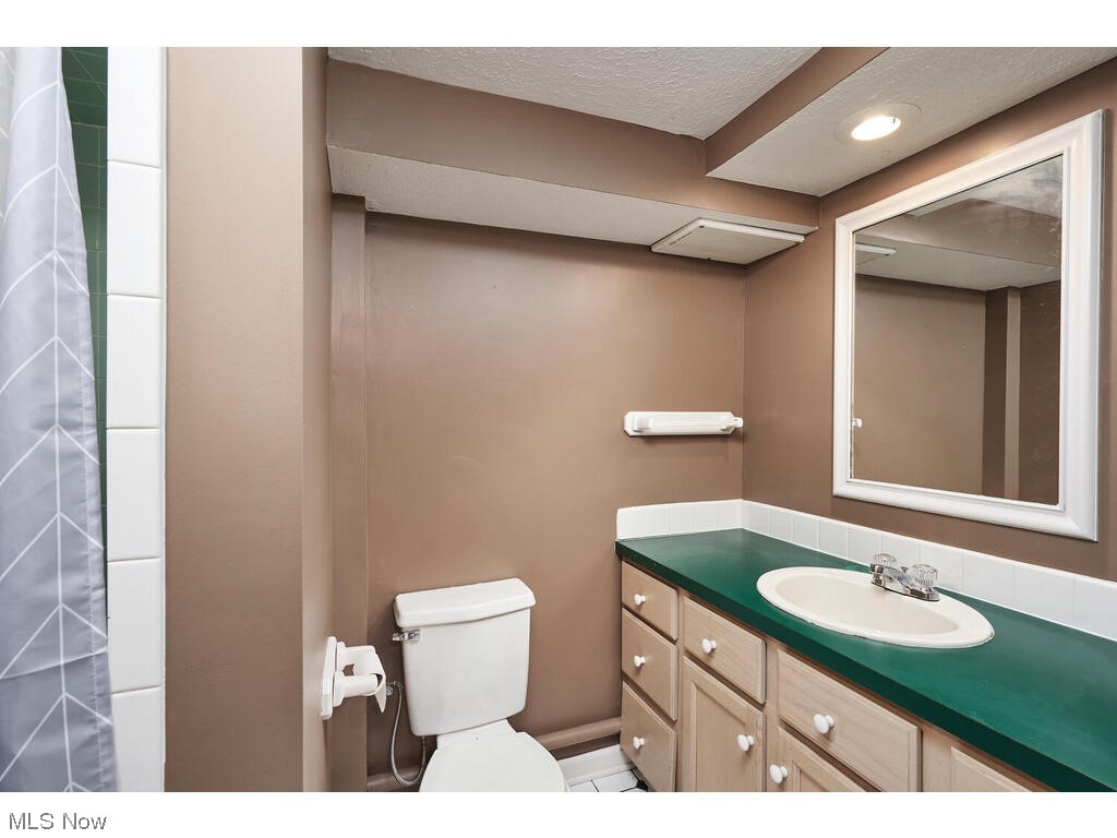 2468 Ridgewood Road Akron, OH 44313 - Photo 18 of 21 Bathroom featuring oversized vanity and mirror