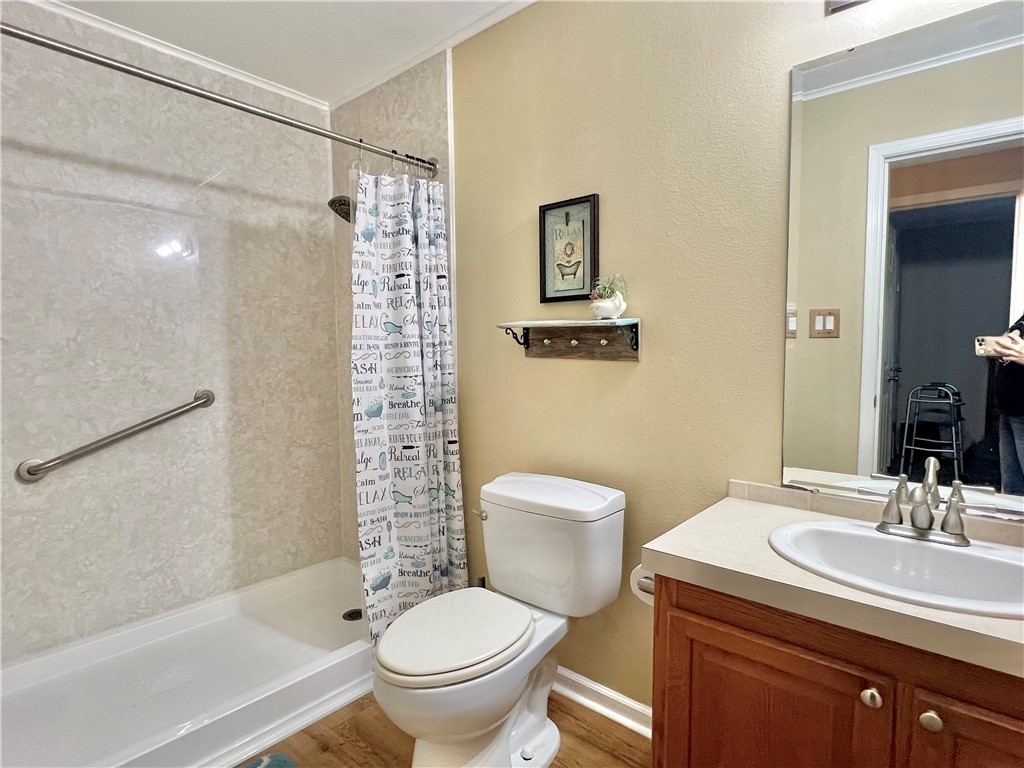 153 Boenig Road Woodsboro, TX 78393 - Photo 17 of 25 Walk-in shower with folding wooden seat