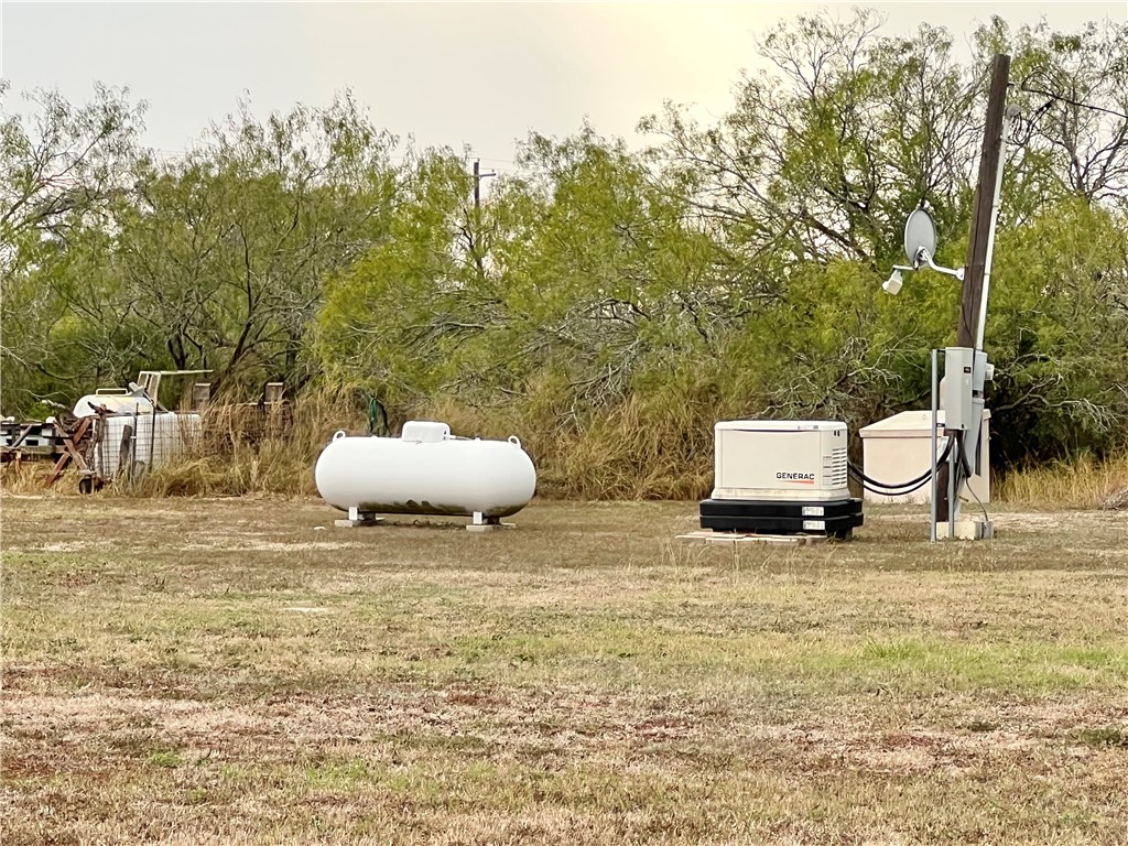 153 Boenig Road Woodsboro, TX 78393 - Photo 21 of 25 Propane tank and Generac