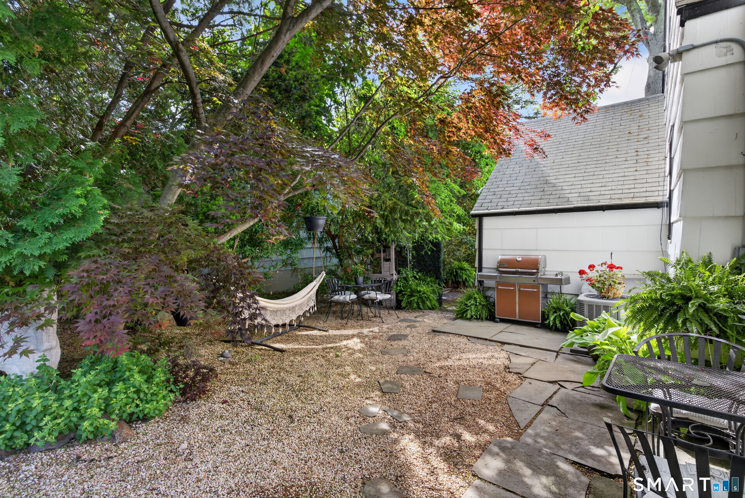 68 Old Elm Road Fairfield, CT 06825 - Photo 33 of 40 a view of a chair and table in the garden