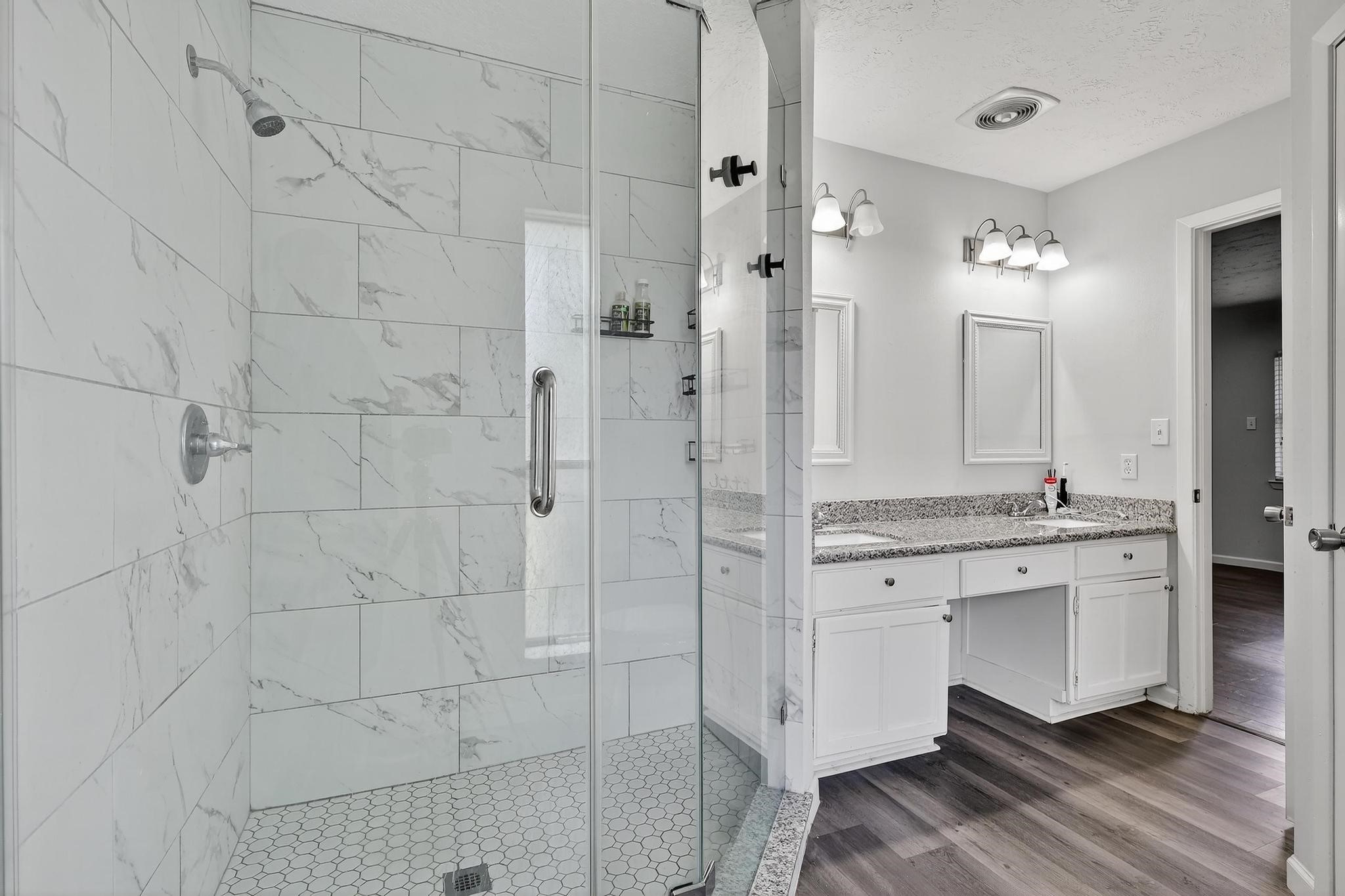 7331 Misty Morning Drive Humble, TX 77346 - Photo 17 of 19 a bathroom with a granite countertop shower sink and mirror