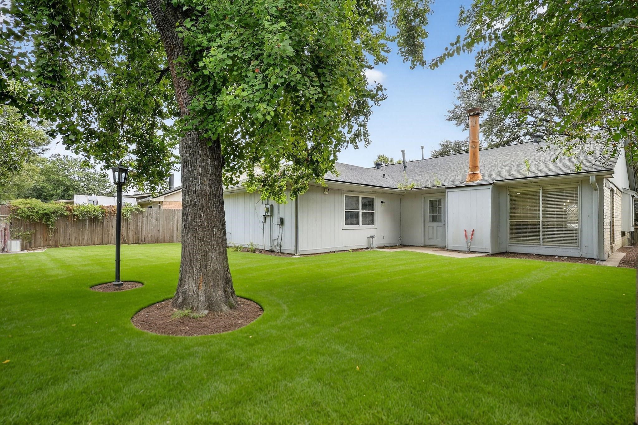 7331 Misty Morning Drive Humble, TX 77346 - Photo 19 of 19 a front view of a house with garden and trees