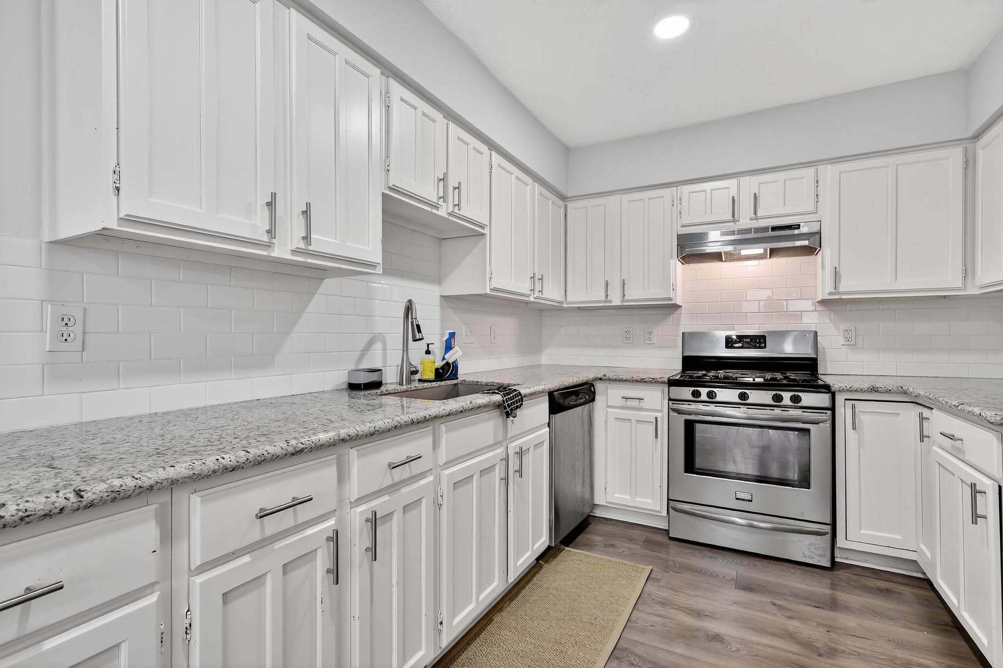 7331 Misty Morning Drive Humble, TX 77346 - Photo 5 of 19 a kitchen with stainless steel appliances granite countertop a sink and cabinets