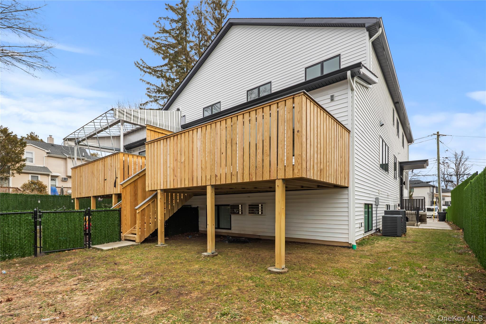 23 Singer Avenue, Unit 211 Spring Valley, NY 10977 - Photo 45 of 45 a view of a house with a yard