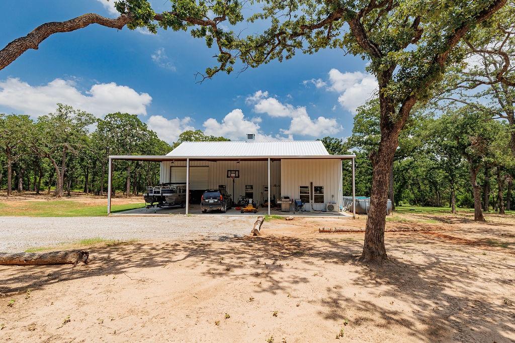 2094 Jim Harry Loop Sunset, TX 76270 - Photo 36 of 40 spray foamed shop with rv hookups and water, kitchen, and guest quarters