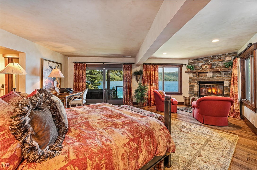 422 Gonowabie Road Crystal Bay, NV 89402 - Photo 20 of 49 a bed room with a bed and large windows