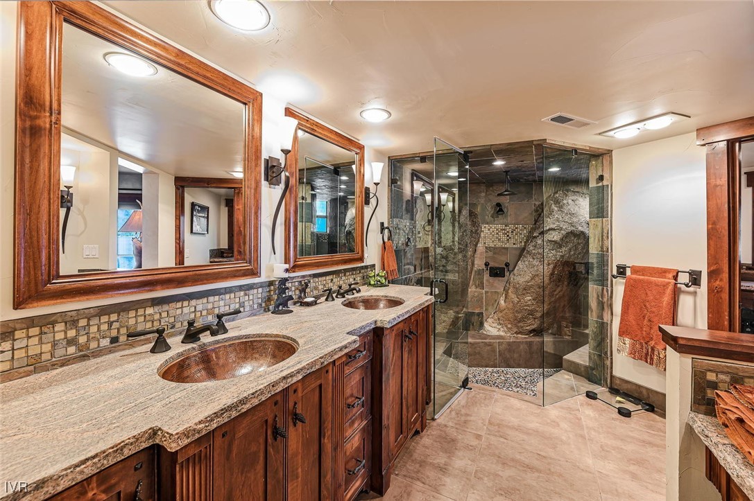 422 Gonowabie Road Crystal Bay, NV 89402 - Photo 27 of 49 a bathroom with a sink double vanity and a mirror
