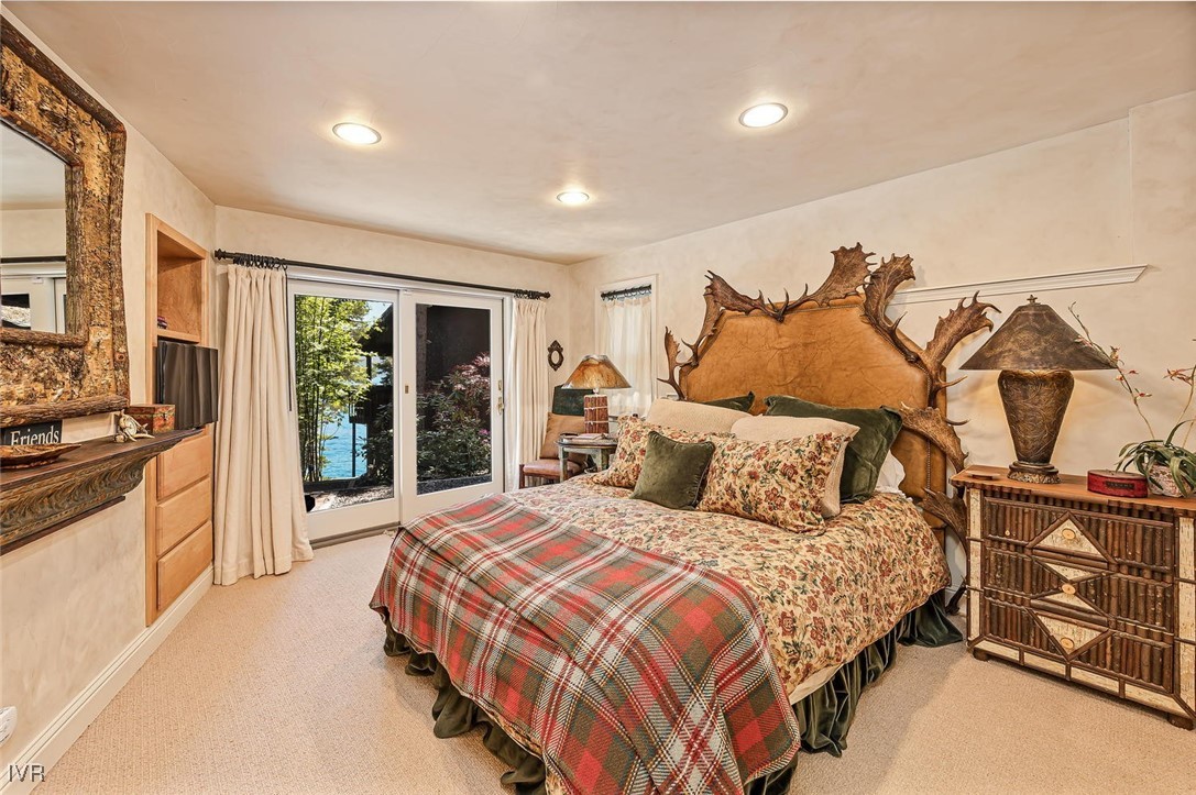 422 Gonowabie Road Crystal Bay, NV 89402 - Photo 28 of 49 a bedroom with a bed and cabinets