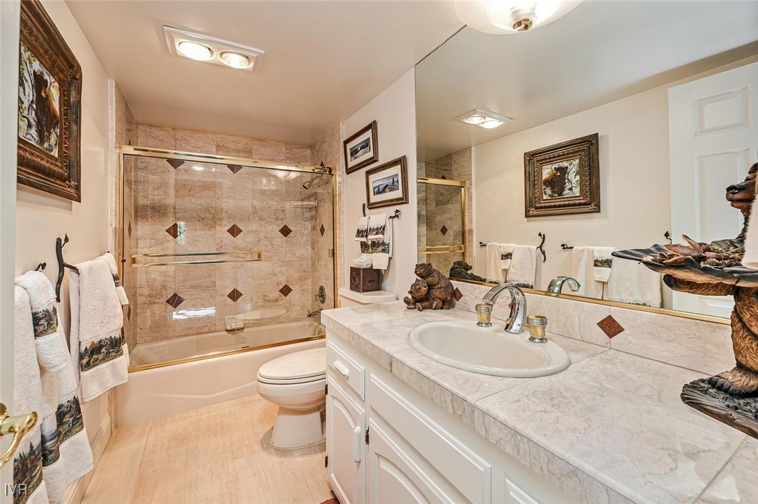 422 Gonowabie Road Crystal Bay, NV 89402 - Photo 32 of 49 a bathroom with a sink a toilet and a large mirror