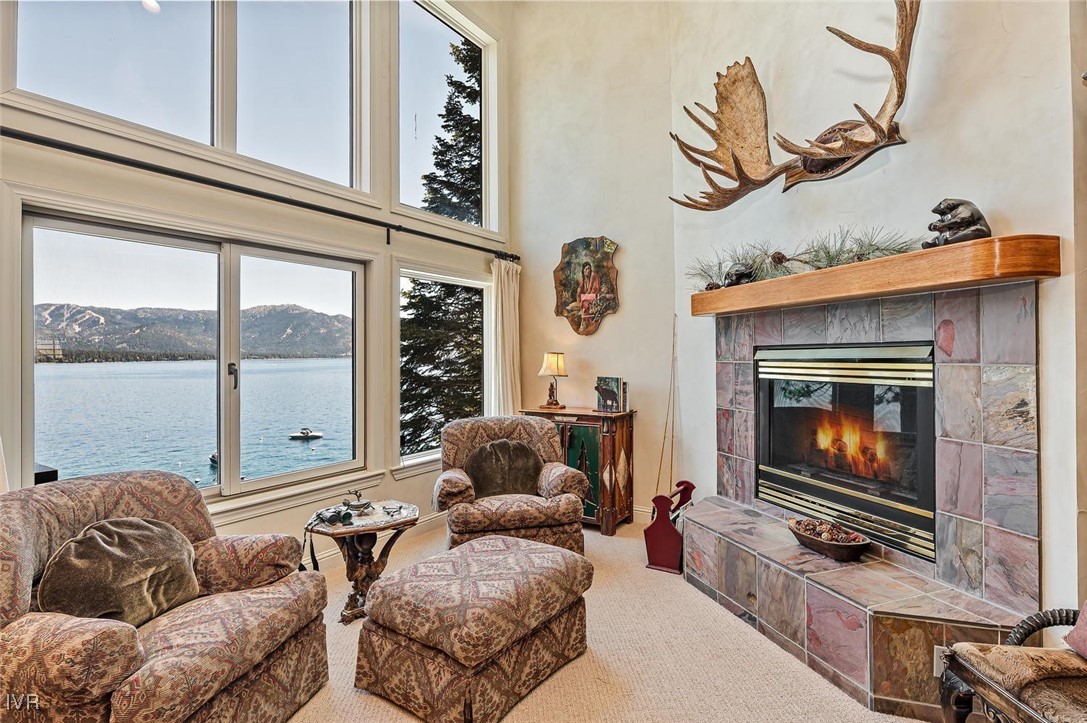 422 Gonowabie Road Crystal Bay, NV 89402 - Photo 5 of 49 a living room with furniture a flat screen tv and a fireplace
