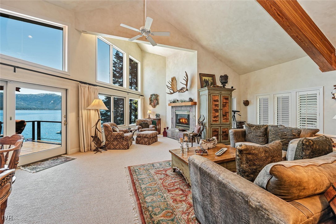 422 Gonowabie Road Crystal Bay, NV 89402 - Photo 7 of 49 a living room with furniture fireplace and a large window