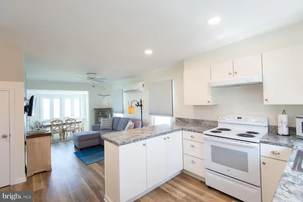 a kitchen with a refrigerator and a sink