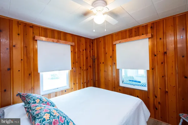 a bedroom with a bed and a table in it