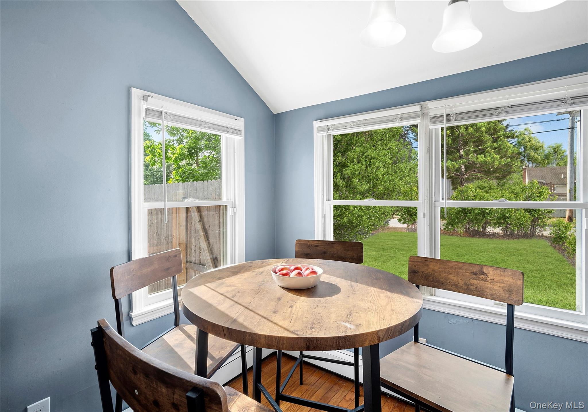 69 Locust Drive Mastic Beach, NY 11951 - Photo 2 of 13 a view of a dining room with furniture window and outside view