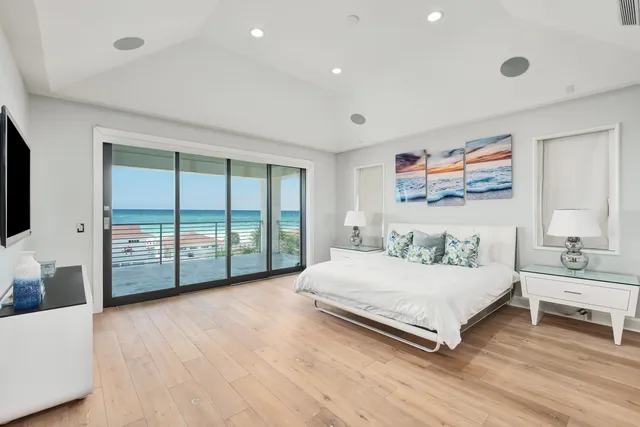 a spacious bedroom with a bed and a window