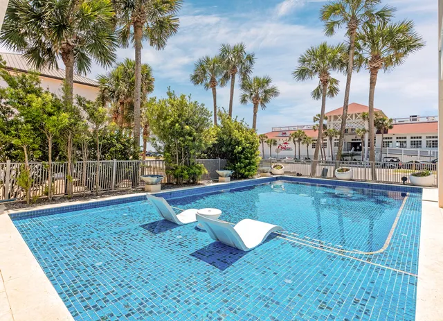 a front view of a building with a garden