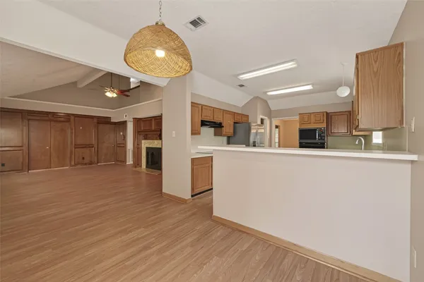 a kitchen with stainless steel appliances granite countertop a sink and cabinets