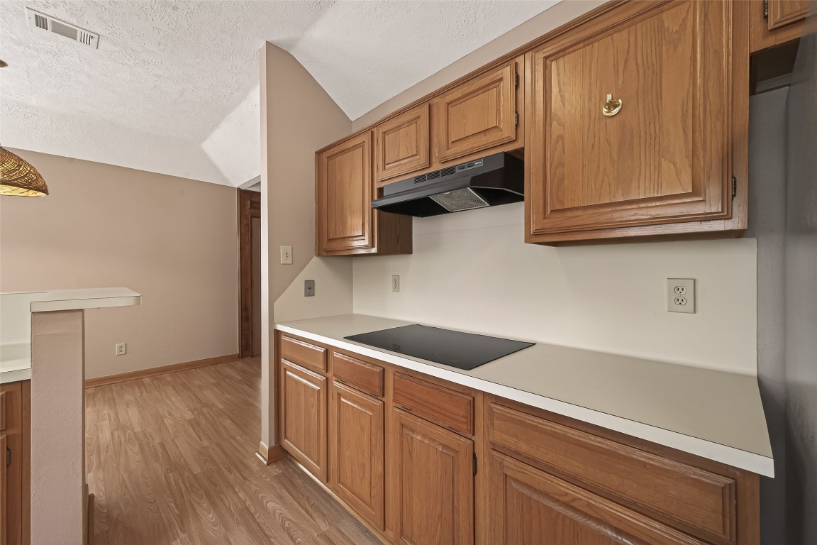 5003 Dawn Lily Drive Spring, TX 77388 - Photo 21 of 49 a kitchen with stainless steel appliances granite countertop a sink and cabinets