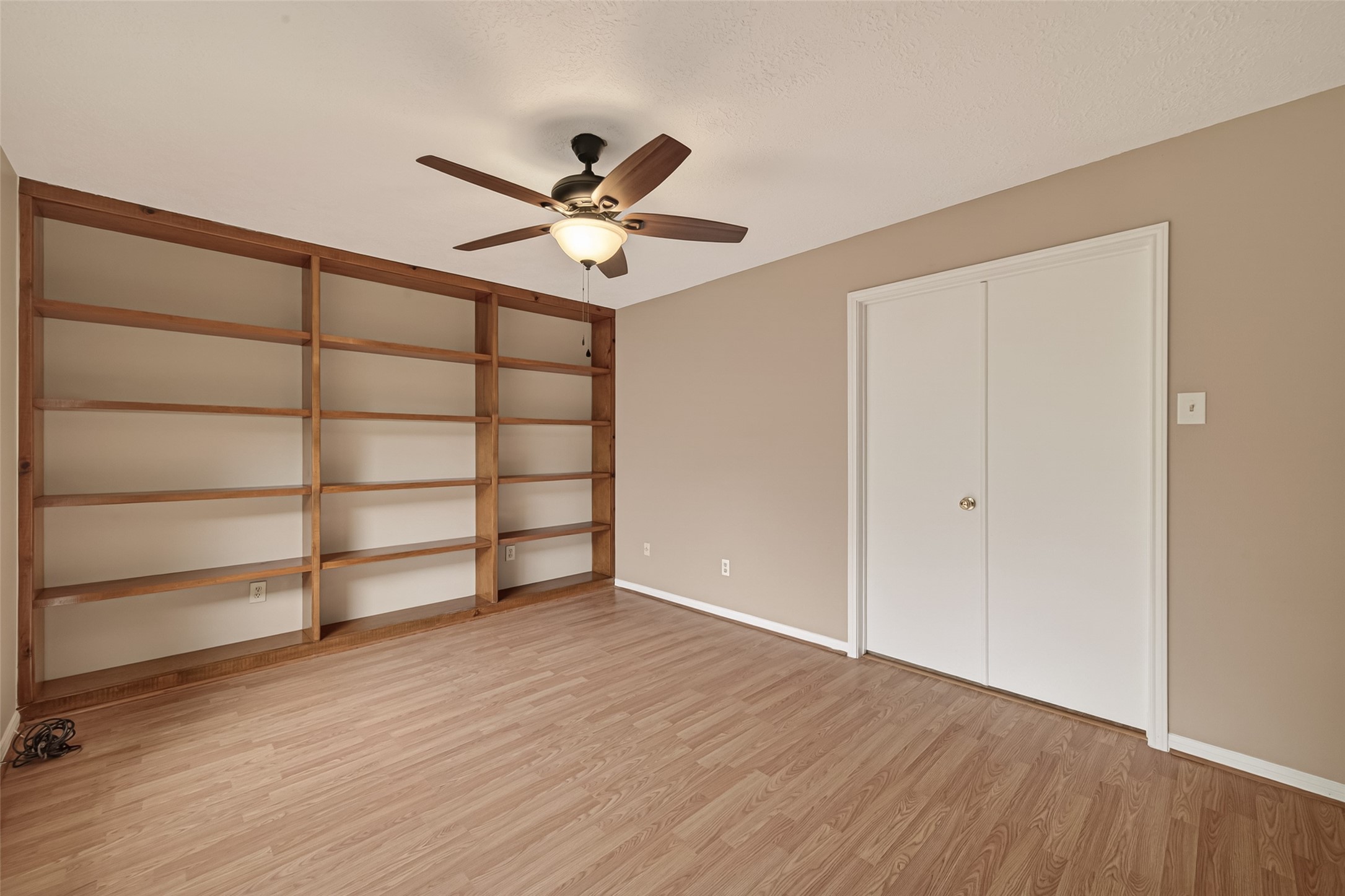 5003 Dawn Lily Drive Spring, TX 77388 - Photo 26 of 49 a view of an empty room with wooden floor and a window