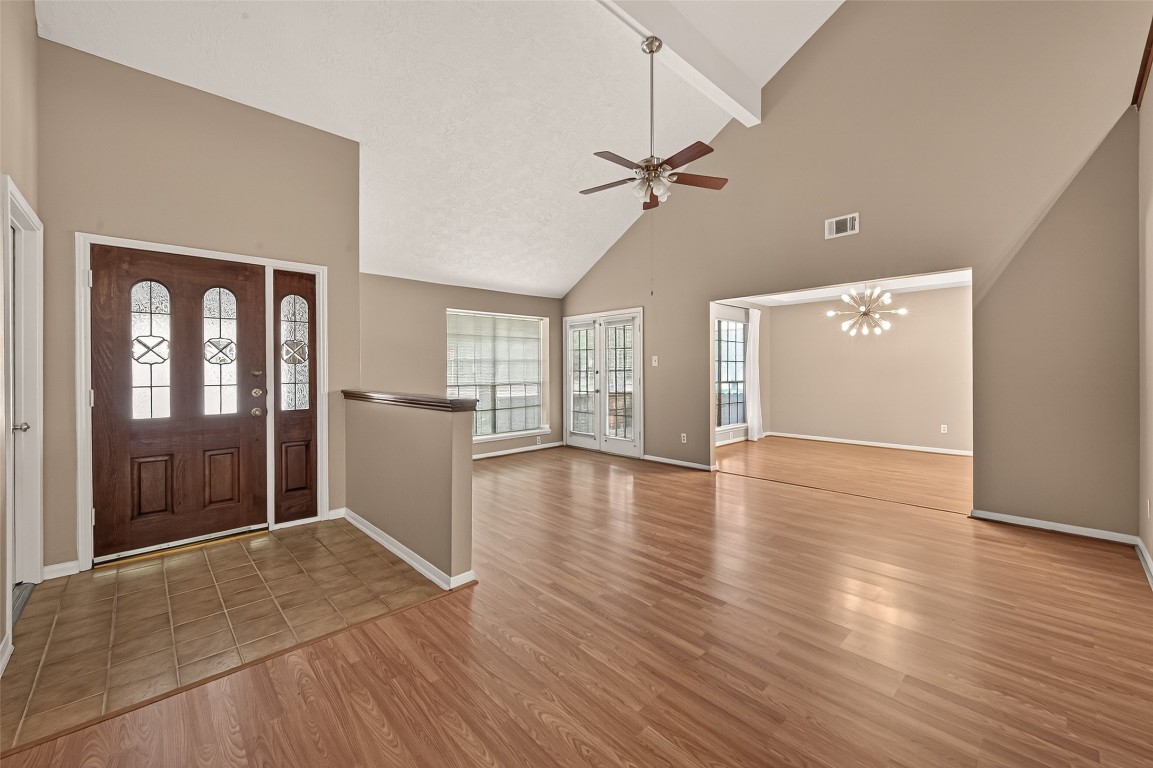 5003 Dawn Lily Drive Spring, TX 77388 - Photo 5 of 49 a view of a livingroom with wooden floor and a ceiling fan