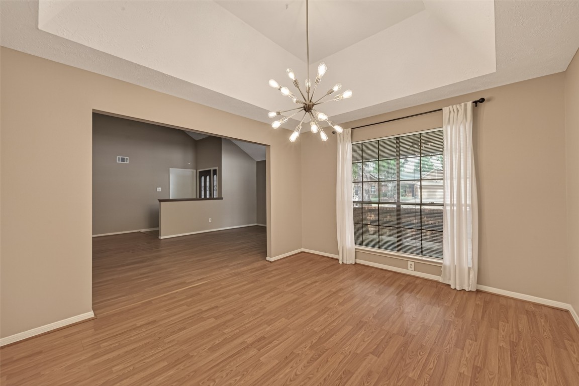 5003 Dawn Lily Drive Spring, TX 77388 - Photo 10 of 49 a view of a livingroom with a ceiling fan window and wooden floor