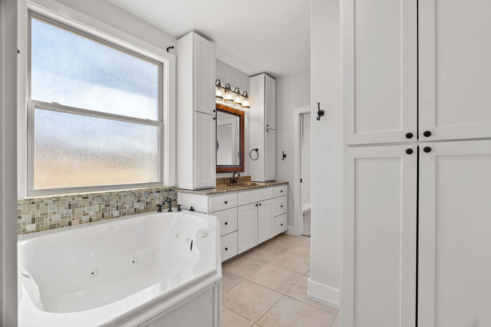 110 Chaumont Street Kingsland, TX 78639 - Photo 17 of 29 a bathroom with a bathtub and a sink