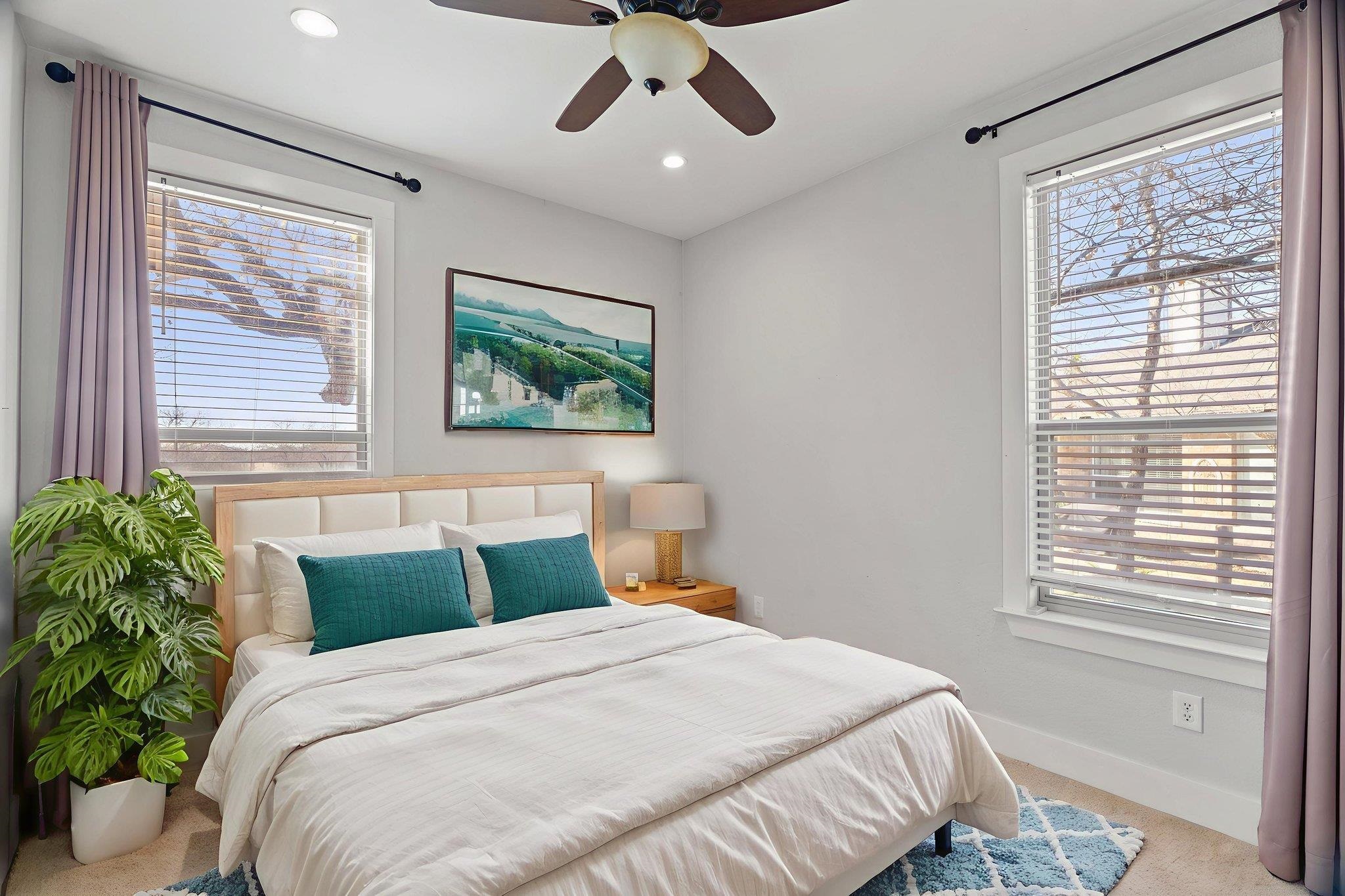 110 Chaumont Street Kingsland, TX 78639 - Photo 21 of 29 a bedroom with a large bed and a window