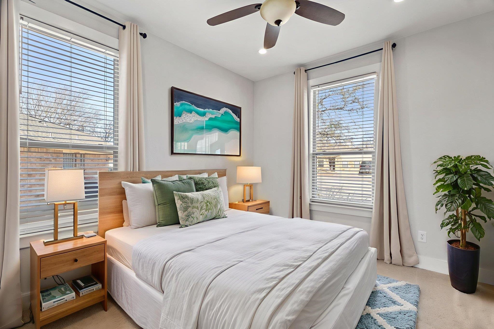 110 Chaumont Street Kingsland, TX 78639 - Photo 24 of 29 a bedroom with a large bed and a potted plant