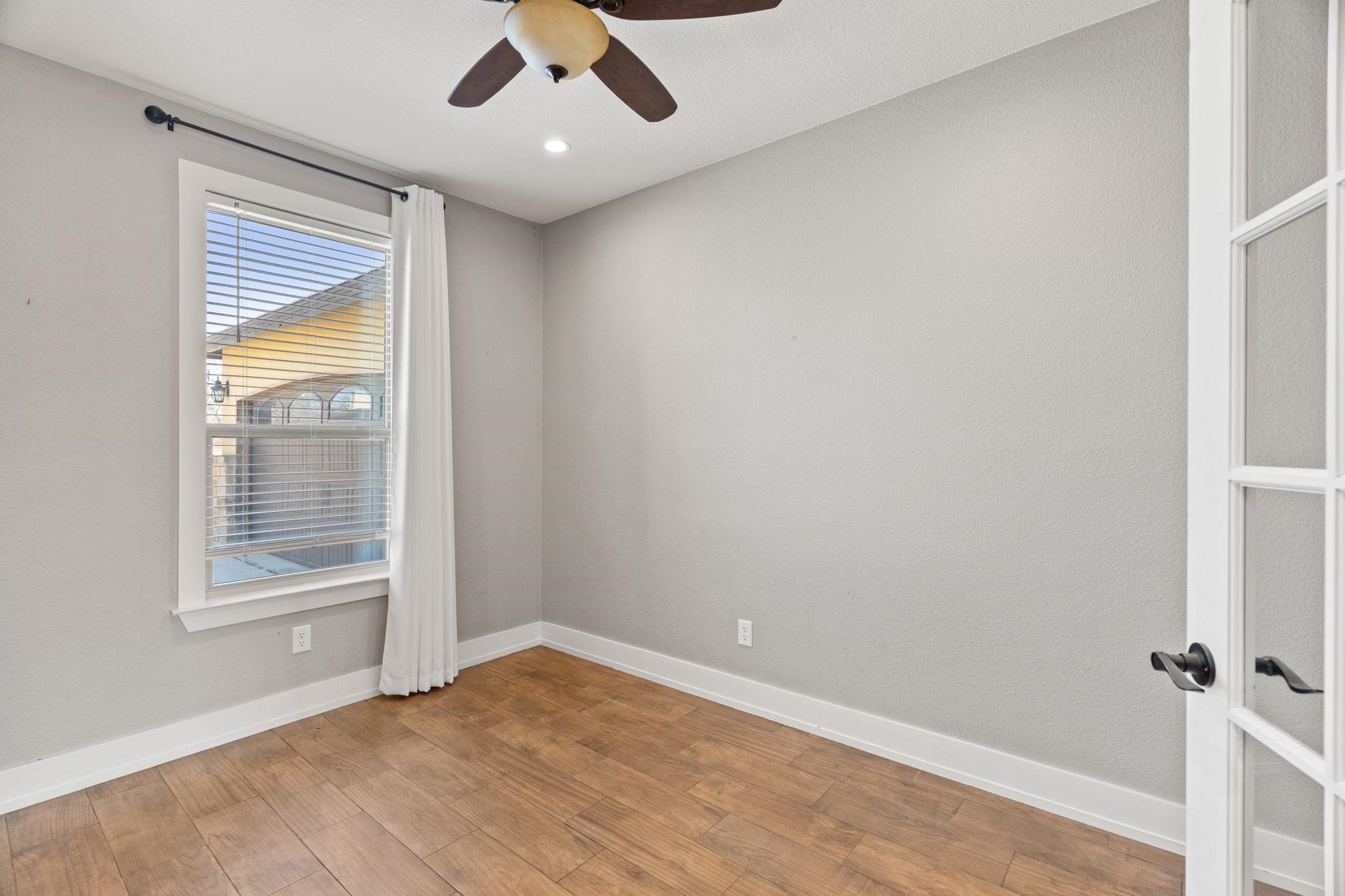 110 Chaumont Street Kingsland, TX 78639 - Photo 6 of 29 a view of an empty room with a window