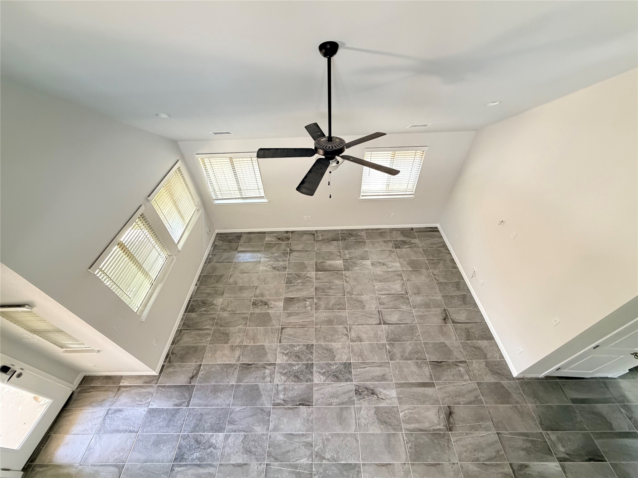 2813 Hopi Path, Unit 11 Leander, TX 78641 - Photo 9 of 17 Detailed view of ceiling fan and baseboards