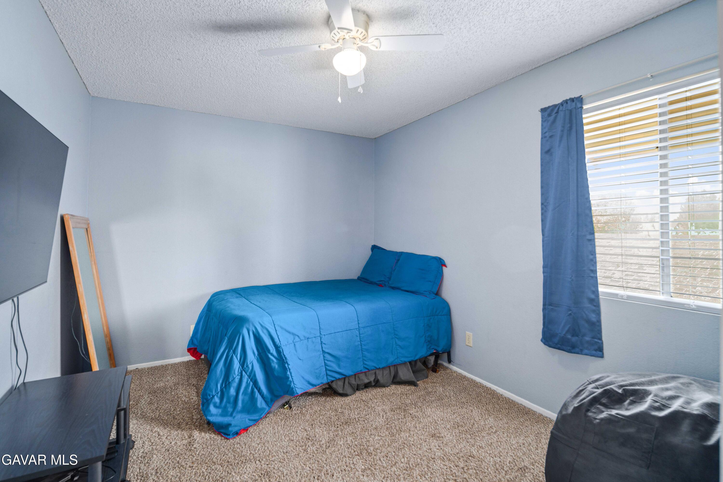 1605 Bluebell Street Lancaster, CA 93535 - Photo 30 of 40 a bedroom with bed and window