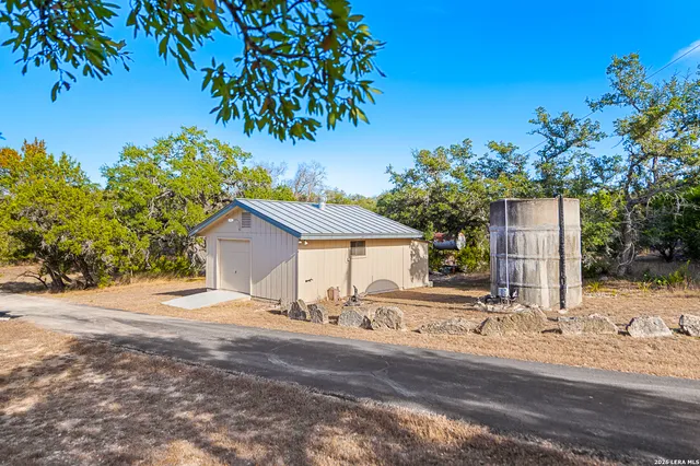 a living room with furniture and large windows