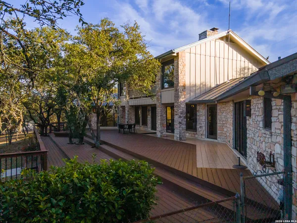 a view of a house with wooden deck