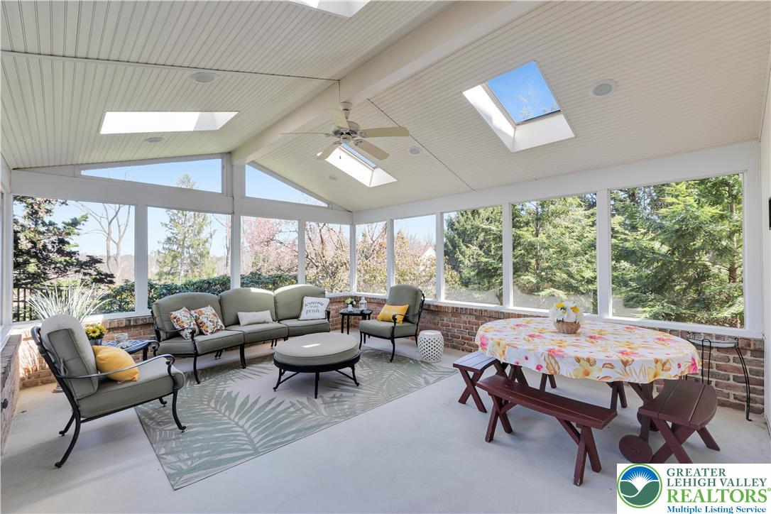 4059 Old Sentry Road Allentown, PA 18104 - Photo 14 of 39 A tranquil sunroom provides abundant natural illumination, offering a serene connection to the outdoors.