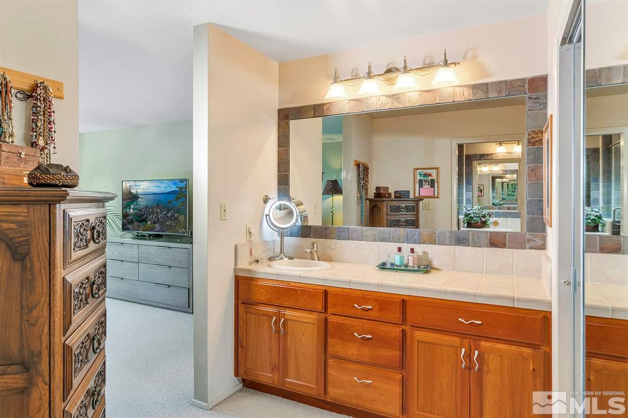 253 Cheyenne Circle Zephyr Cove, NV 89448 - Photo 13 of 25 a bathroom with a sink double vanity and a mirror