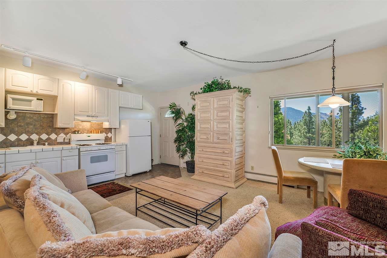 253 Cheyenne Circle Zephyr Cove, NV 89448 - Photo 14 of 25 a living room with furniture and a large window