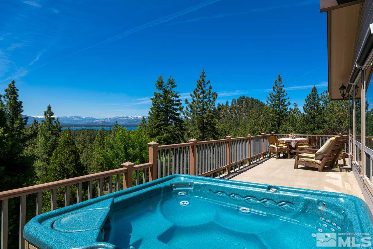 253 Cheyenne Circle Zephyr Cove, NV 89448 - Photo 16 of 25 a view of a balcony with two chairs and a table