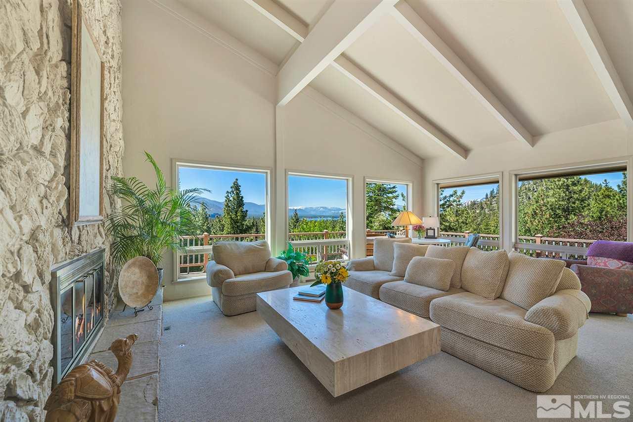 253 Cheyenne Circle Zephyr Cove, NV 89448 - Photo 4 of 25 a living room with furniture potted plant and a large window