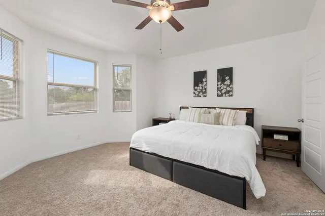 a bedroom with a bed and window