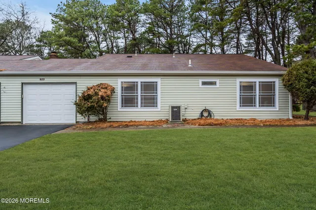 a huge green field with lots of trees