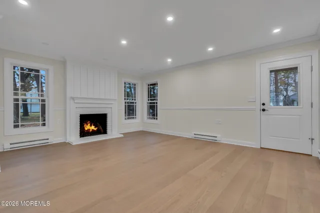 a view of an empty room with a fireplace