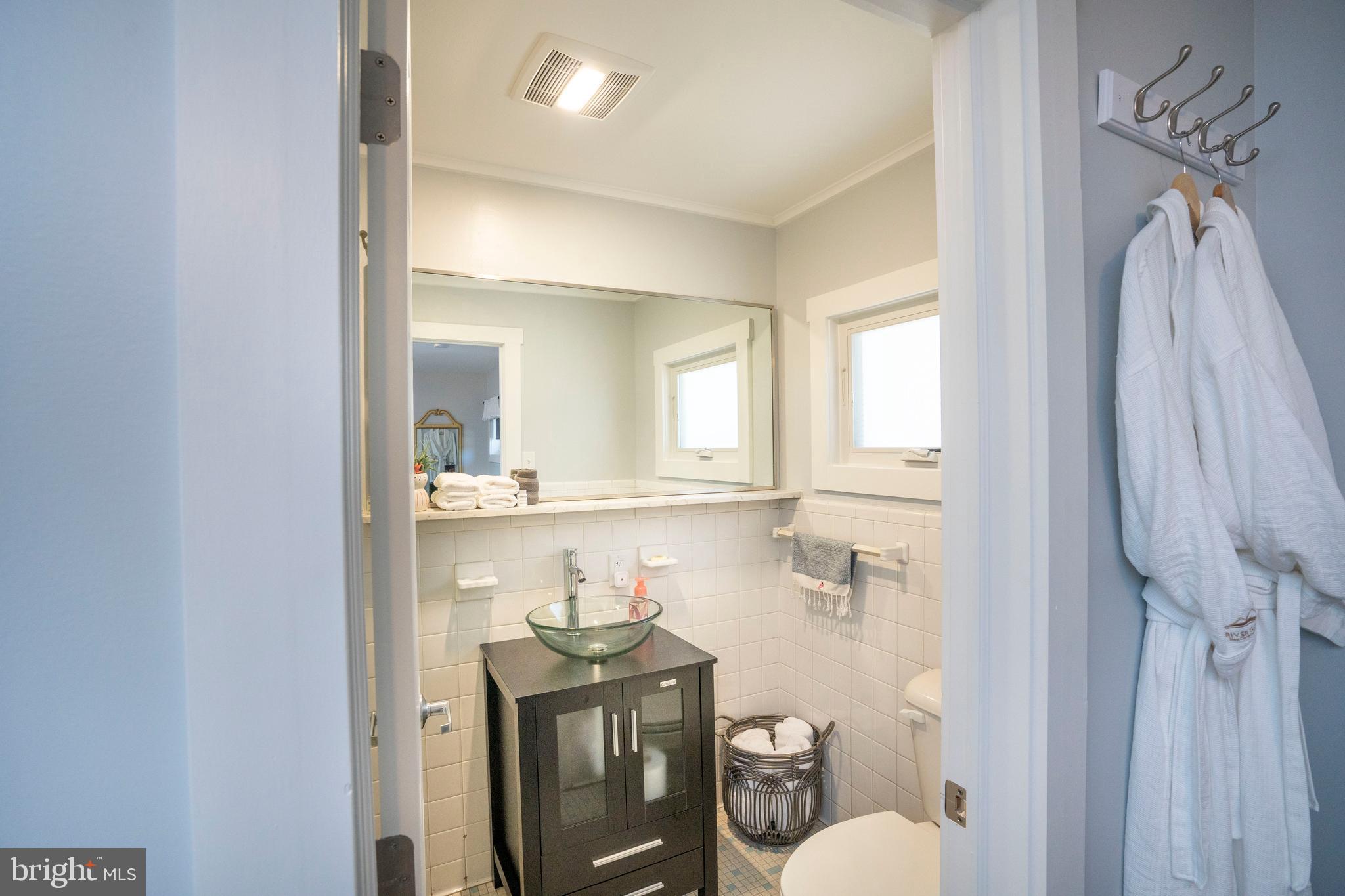66 Front Drive Mount Union, PA 17066 - Photo 56 of 93 a bathroom with a sink a toilet and a mirror