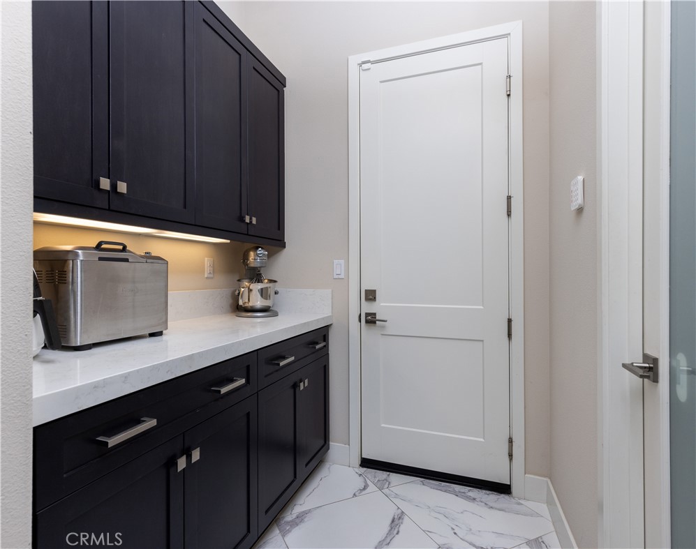 93 Turnstone Irvine, CA 92618 - Photo 18 of 52 a view of cabinets with wooden floor