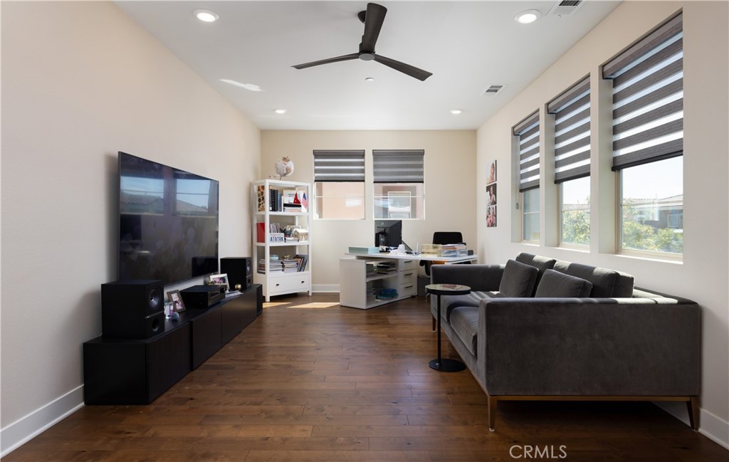 93 Turnstone Irvine, CA 92618 - Photo 25 of 52 a living room with furniture and a flat screen tv